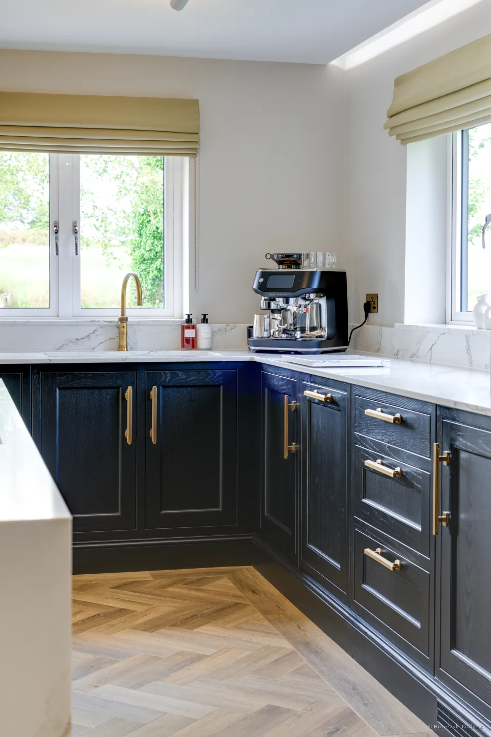 Charcoal Shaker corner, white quartz and sink under the windows.