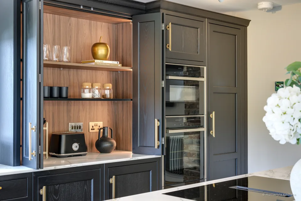 Charcoal Shaker display wall with coffee machine, ovens and glassware shelves.