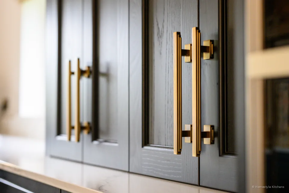 Charcoal Shaker doors with long brass pulls.