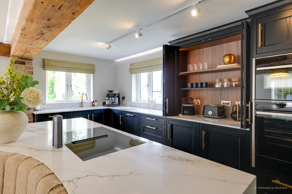 Charcoal Shaker run, white quartz, Neff vented hob and open breakfast cupboard.