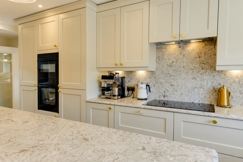Quartz island looking along the hob run, coffee machine on the worktop.