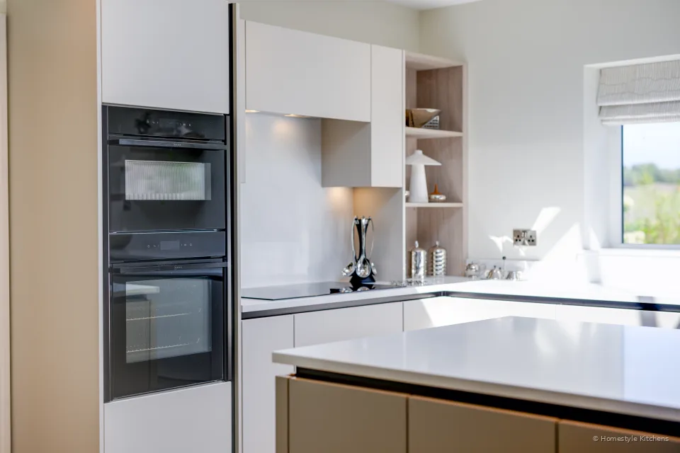 Oven bank with cream and mocha units, worktop in front.