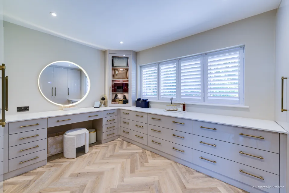 Dressing bench and drawer run, white quartz top, herringbone oak floor.